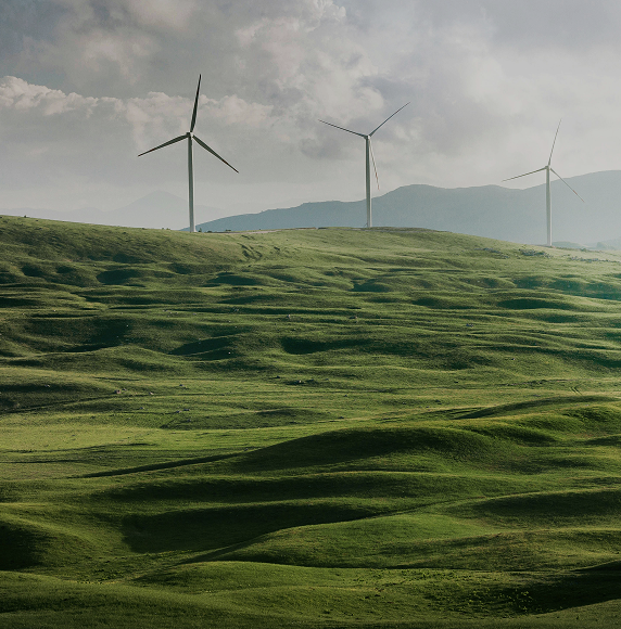 Wind mill on a green field